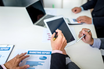 Group of business people discuss the financial investment at meeting.