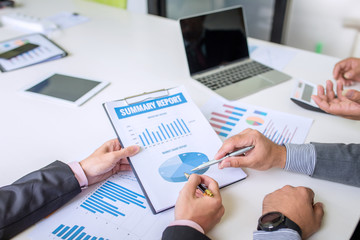 Group of business people discuss the financial investment at meeting.