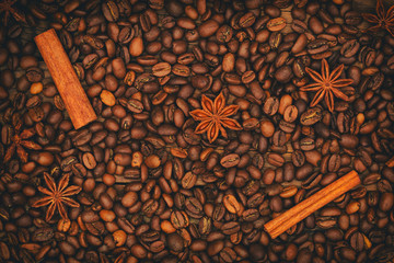 Background of coffee beans. Coffee beans, cinnamon sticks and star anise.