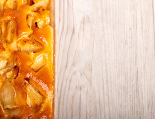 Home made apple pie on a wooden table