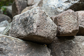 Pile of granite boulders of grey color