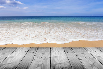Fototapeta premium wooden floor with beautiful beach blue sky scenery for background.