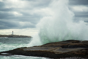Naklejka na ściany i meble Hurricane surf crashes on the rocks at Peggy's Cove