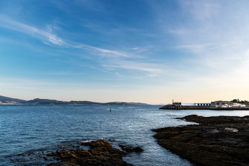 Cliffs and small lighthouse in Pontevedra, Spain