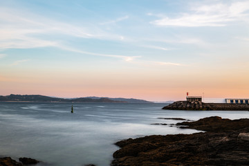 Cliffs and small lighthouse in Pontevedra, Spain