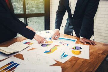 Teamwork process, business people working in the office discussing documents and ideas at meeting