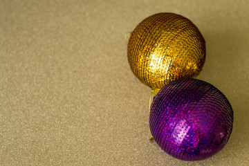 Golden texture with colorful bokeh. Christmas and New year decorations and background.