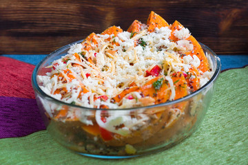 Vegan mixture of orange pumkin, mixed vegetables, herbs and cheese