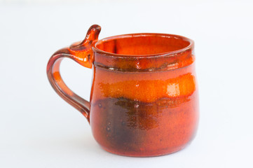 Orange pottery mug