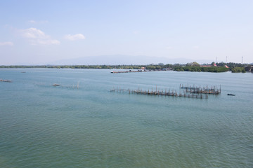 Fototapeta premium Fishing equipment as woodern on the river