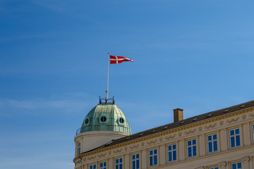 Danish flag flying atop a government building