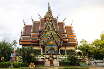 The Thai temple in Wat Plai Laem in Samui Island Thailand, with the statue of the serpent king and elephant.