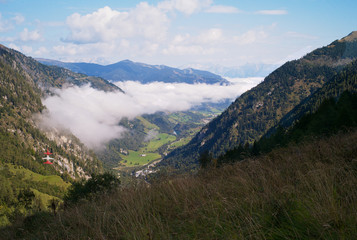 Clouds Floating through an Alpine Valley near Kitzsteinhorn, Austria