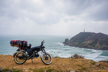 Fototapeta na wymiar Bike on the rock. Moto travel in Vietnam