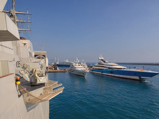 military and cruise boats in the ancient port of Genoa. Italy