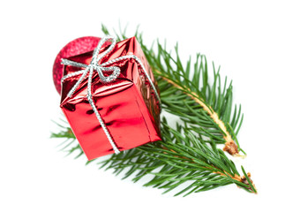 Fir tree branch and red gift box isolated on white background. Christmas and New Year design elements.