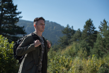 Naklejka premium serious hiker with backpack 