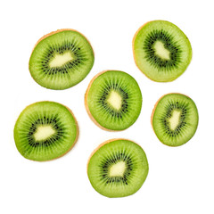Fototapeta premium Kiwi fruit Slices macro. Ripe Kiwi fruit isolated on white background. Fresh tropical abstract background