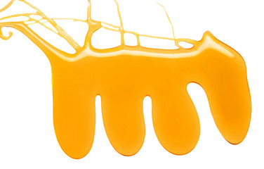 Sweet Honey pouring isolated on white background. Honey liquid textured drop.