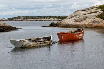 White and red fishing dory in harbour closeup, Peggy's Cove, summer