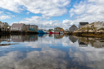 Fototapeta na wymiar Clouds reflected in harbour water, Peggy's Cove Harbour