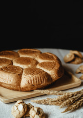 Freshly baked bread on wooden table