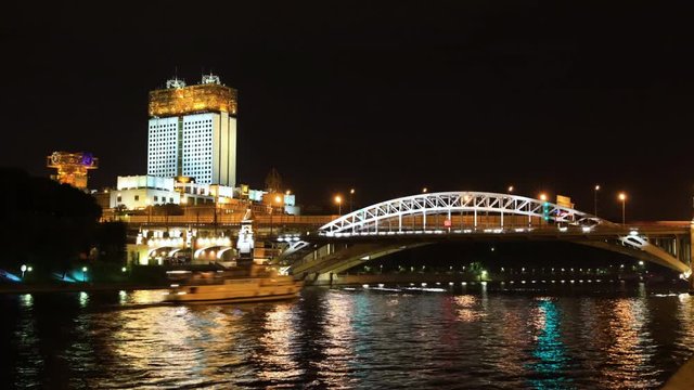 Night timelapse and video of automotive and water traffic, Andreevsky Bridge and the view of the building of the Academy of Sciences and Pushkinskaya Embankment.