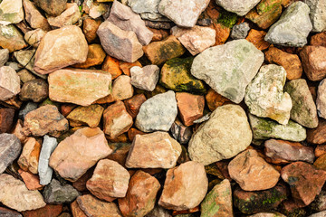 Scattered multi-colored stones for modern background texture and graphic use.