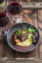 Slowly stewed beef short ribs with potato, mushroom and gravy.