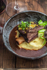 Slowly stewed beef short ribs with potato, mushroom and gravy.