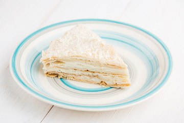 Slice of classic layered cake Napoleon