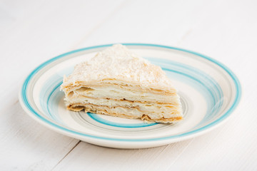 Slice of homemade classic layered cake Napoleon