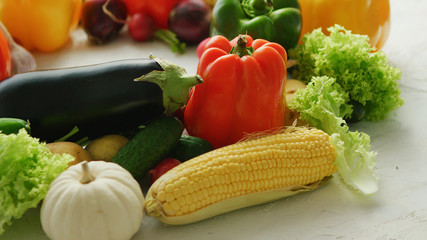 Bright different fresh vegetables laid in heap on white background