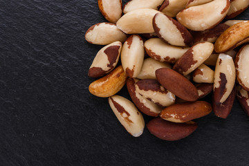brazil nut on a dark stone background