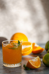 Freshly squeezed orange juice, and orange , close-up