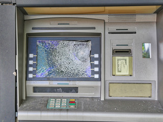Bank robbery and broken ATM concept