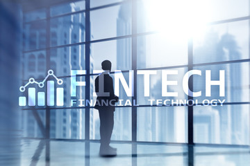 FINTECH - Financial technology, global business and information Internet communication technology. Skyscrapers background. Hi-tech business concept.