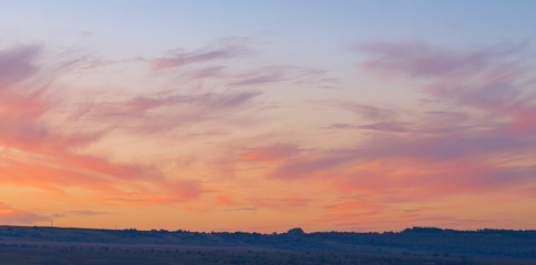 Beautiful atmospheric dramatic clouds in the evening at sunset.