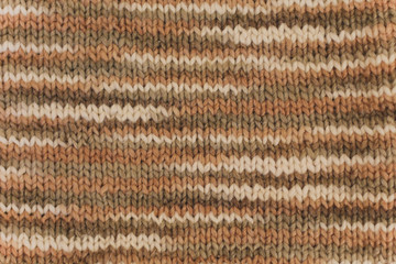 Multicolor knitted background from woolen yarns. Handmade, textured