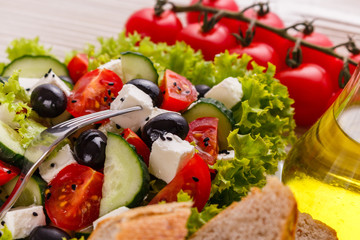 Greek salad on a wooden rustic background