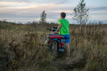 Bicyclist in the field in Russia