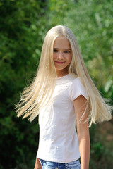 Portrait of a beautiful young girl with long hair