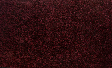 Fototapeta premium Burgundy fabric fluffy rug machine Shoe with pile textured pattern textured collection otherreferats concept background fabric business