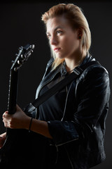 Blonde woman rocker guitarist black dark scene