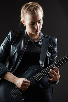 Blonde woman rocker guitarist black dark scene