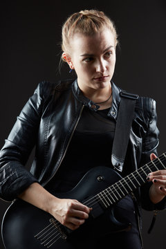 Blonde woman rocker guitarist black dark scene