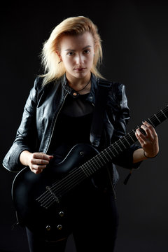 Blonde woman rocker guitarist black dark scene