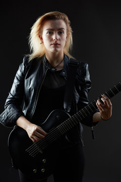 Blonde woman rocker guitarist black dark scene