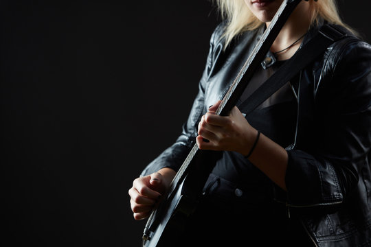 Blonde woman rocker guitarist black dark scene