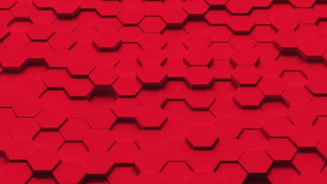 Abstract looping motion background texture of red hexagons.